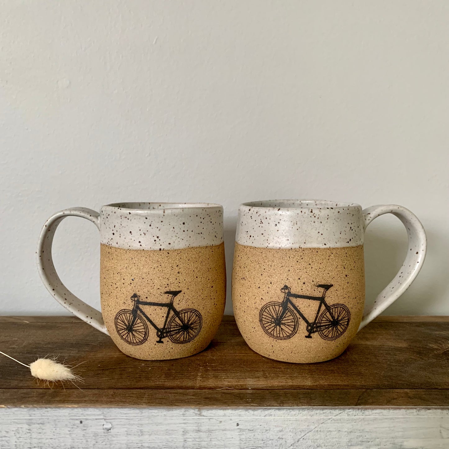 pottery bike mug. The bike is featured on the natural brown speckled clay and accented with a soft white matte glaze on the handle and rim