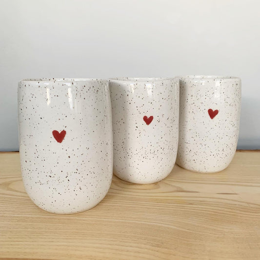 ceramic white speckle sweetheart tumblers with a cute little red heart - perfect for enjoying wine or your favourite hot or cold beverage. Microwave and dishwasher safe